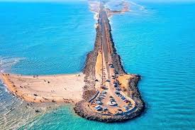 Dhanushkodi beach road curving along turquoise sea