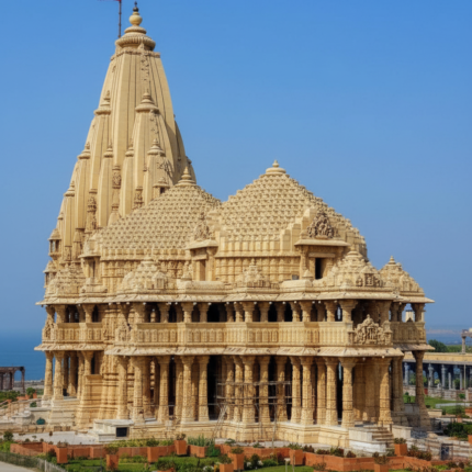 "The magnificent Somnath Temple, a historic Hindu pilgrimage site, featuring intricate stone carvings, towering shikhara, and a vibrant red flag, set against a clear blue sky, with the ocean visible in the background."